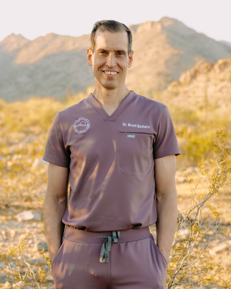 Dr. Bethers smiling while posing in the desert